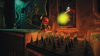 The Darkness: A screenshot of a nervous Sackperson beside a spike trap. Official screenshot from the LittleBigPlanet Website.