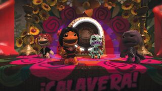 The Wedding Reception: A screenshot of four Sackpeople surrounded by flowers at the reception. Official screenshot from the LittleBigPlanet Website.