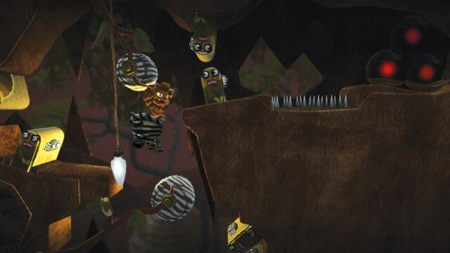 The Meerkat Kingdom: A screenshot of two players swinging through a meerkat tunnel. Official screenshot from the LittleBigPlanet Website.[1]