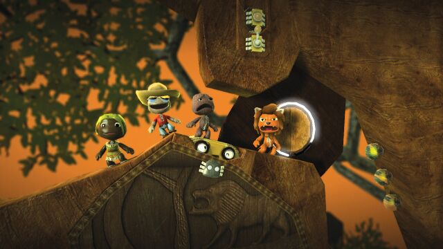 Tunnel Plunge: A screenshot of four players standing around a hiding meerkat. Official screenshot from the LittleBigPlanet Website.[1]